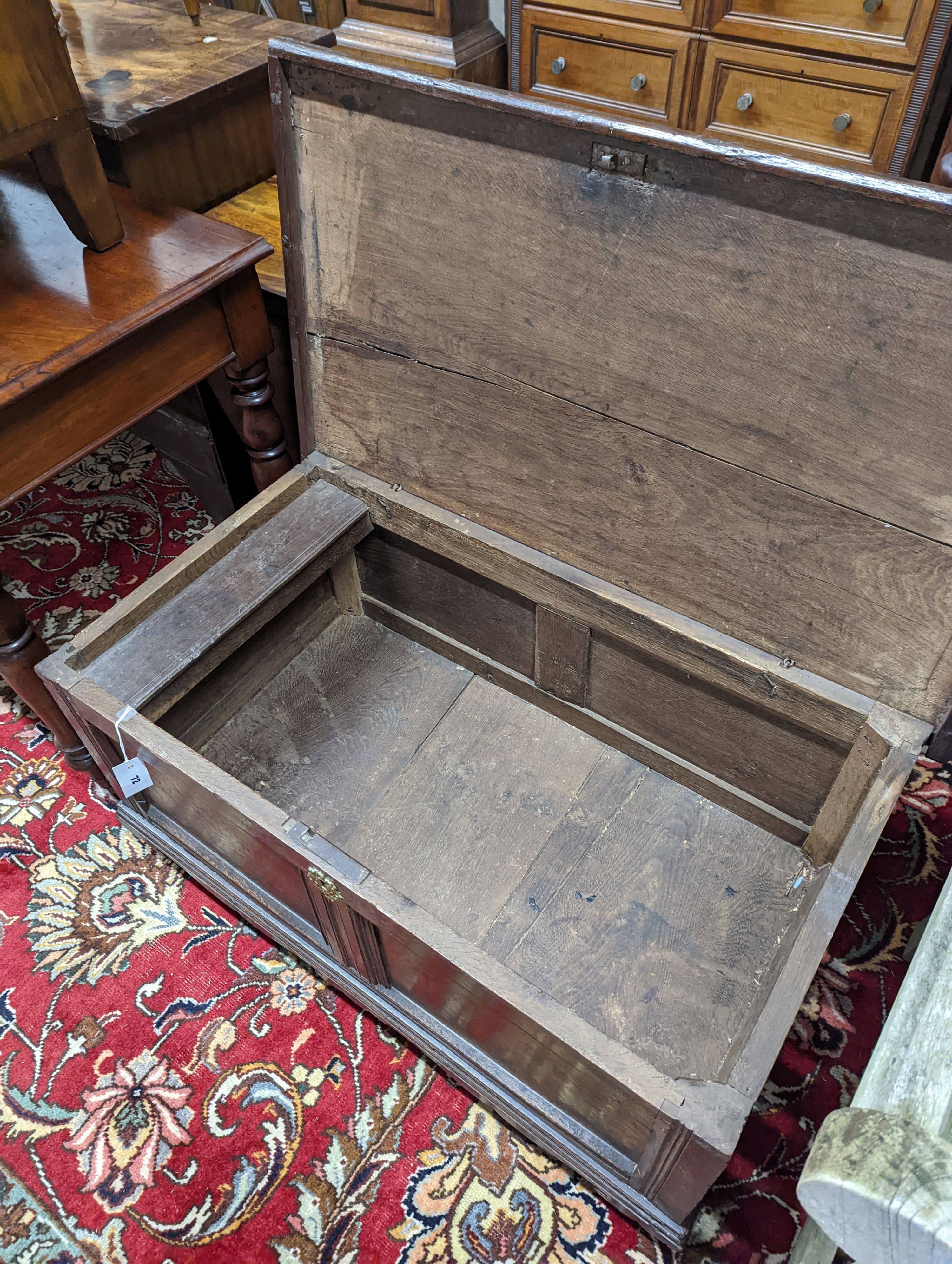 An 18th century panelled oak coffer, length 98cm, depth 54cm, height 59cm